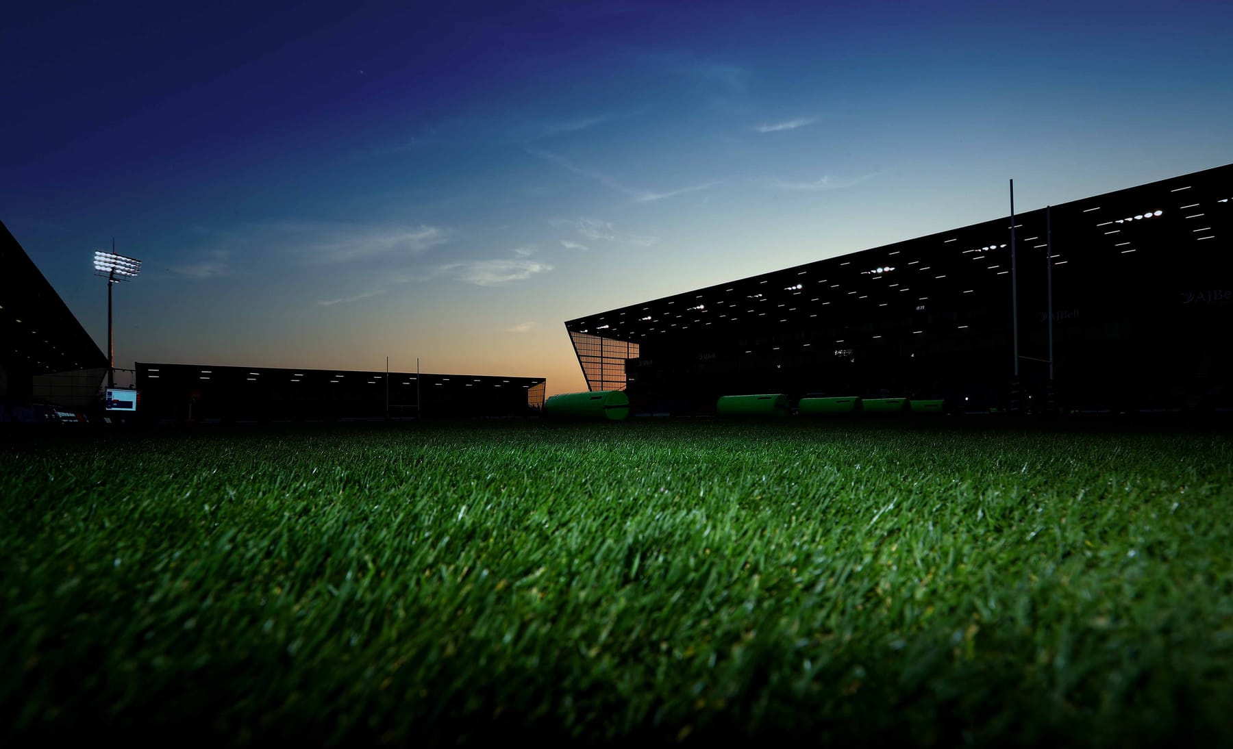 Floodlit stadium at dusk